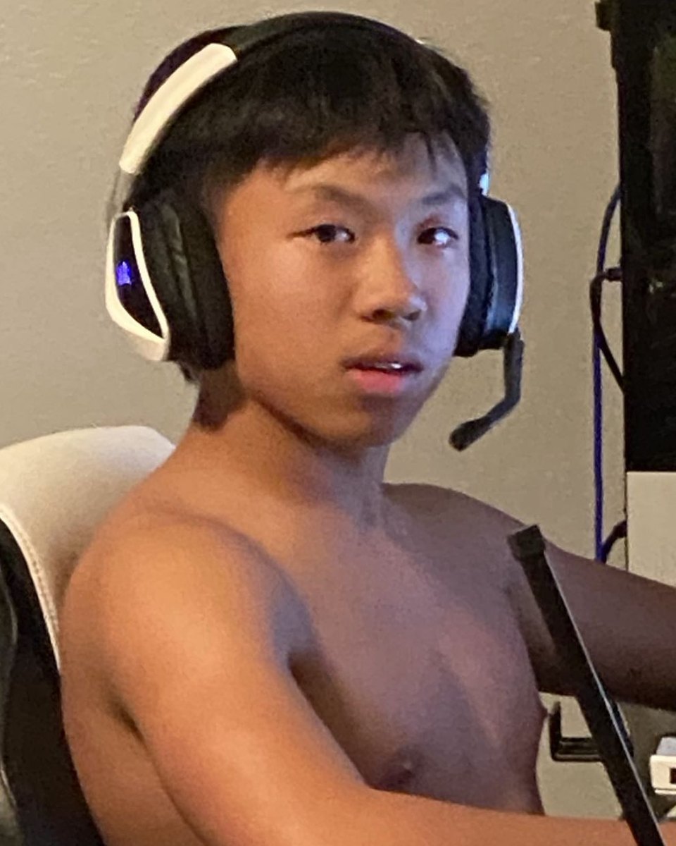 Aiden Tran before, seated at his desk with a slim build