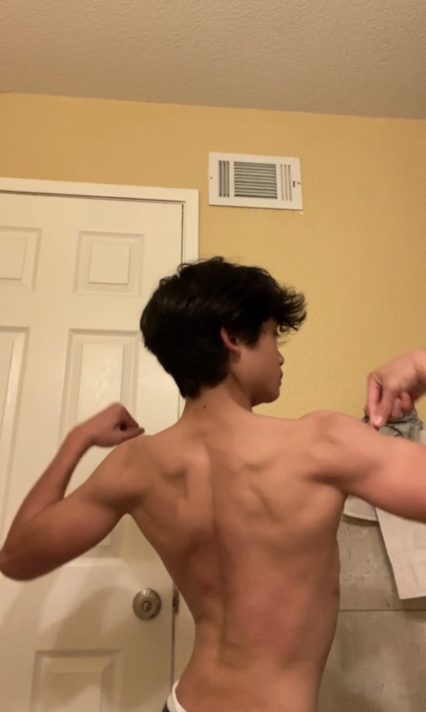 Ethan before, back pose showing a very slim, underweight frame
